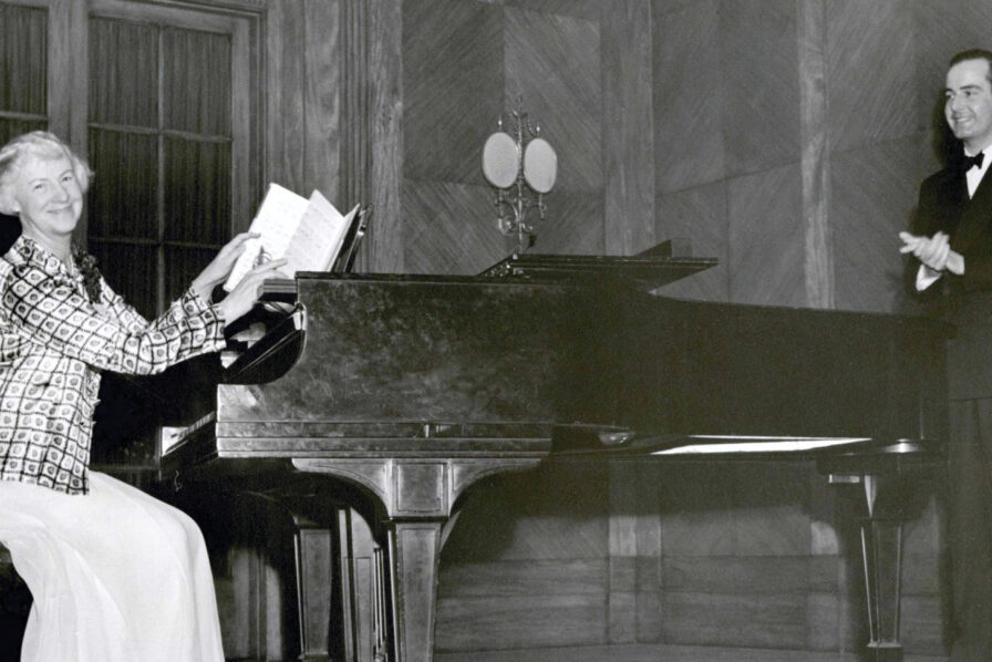 Samuel Barber and Mary Louise Curtis Bok on stage with a piano